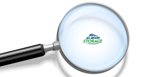 All Aboard Storage logo under a magnifying glass