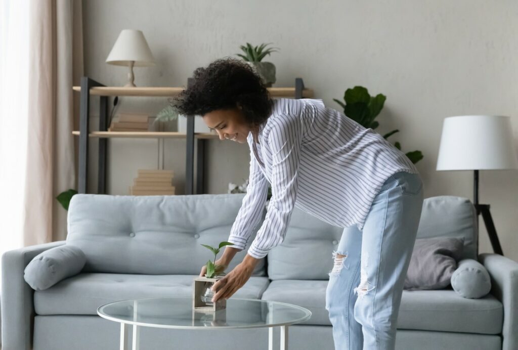 Woman organizing her living room.