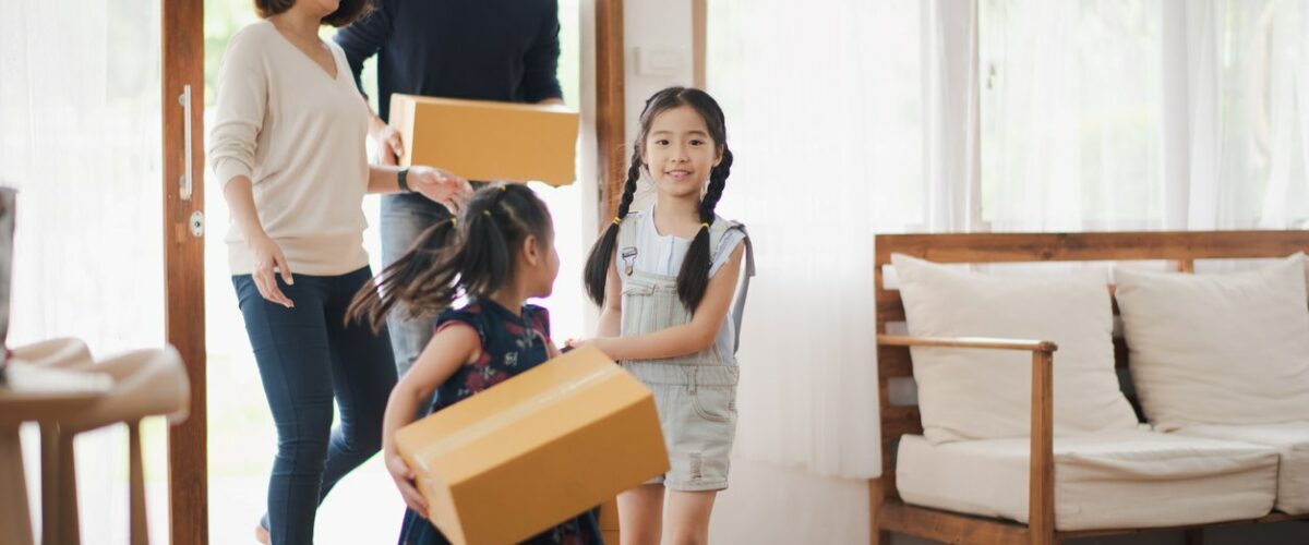 A family of four moving into a new home.