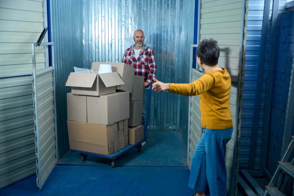 A woman and her son accessing a climate-controlled storage unit, showcasing secure storage solutions.